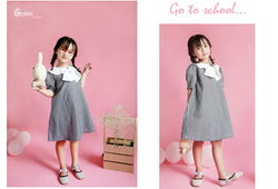 Váy chữ A kẻ nơ trắng